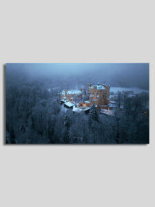 Wandbild von winterlicher Aufnahme Schloss Hohenschwangau in Füssen